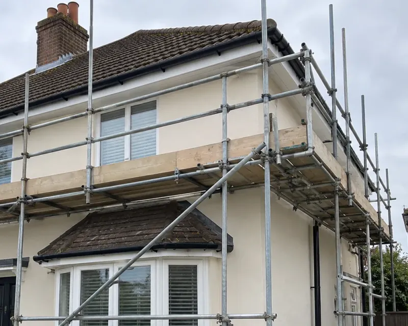 Illustrative scaffolding providing access to gutters, soffits and fascias.