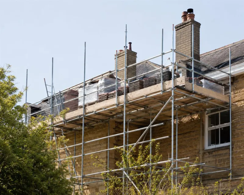 Scaffolding set up to support a roofing crew